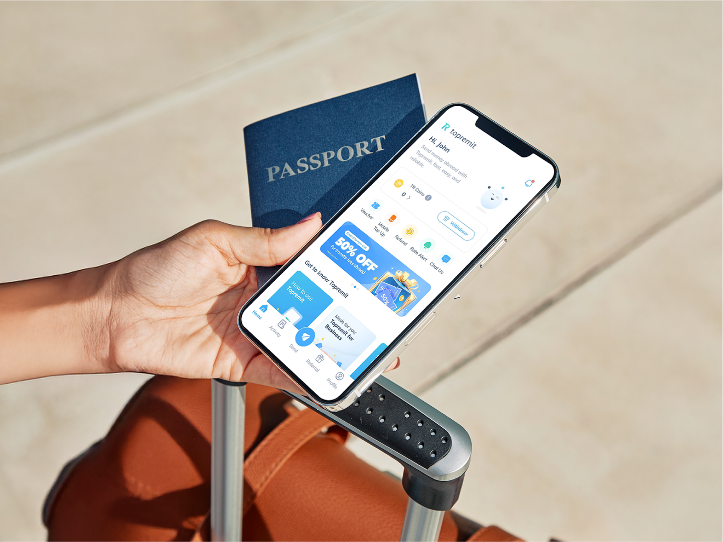 A passport and smartphone displaying Topremit app, showing how expats manage finances when they live in Indonesia
