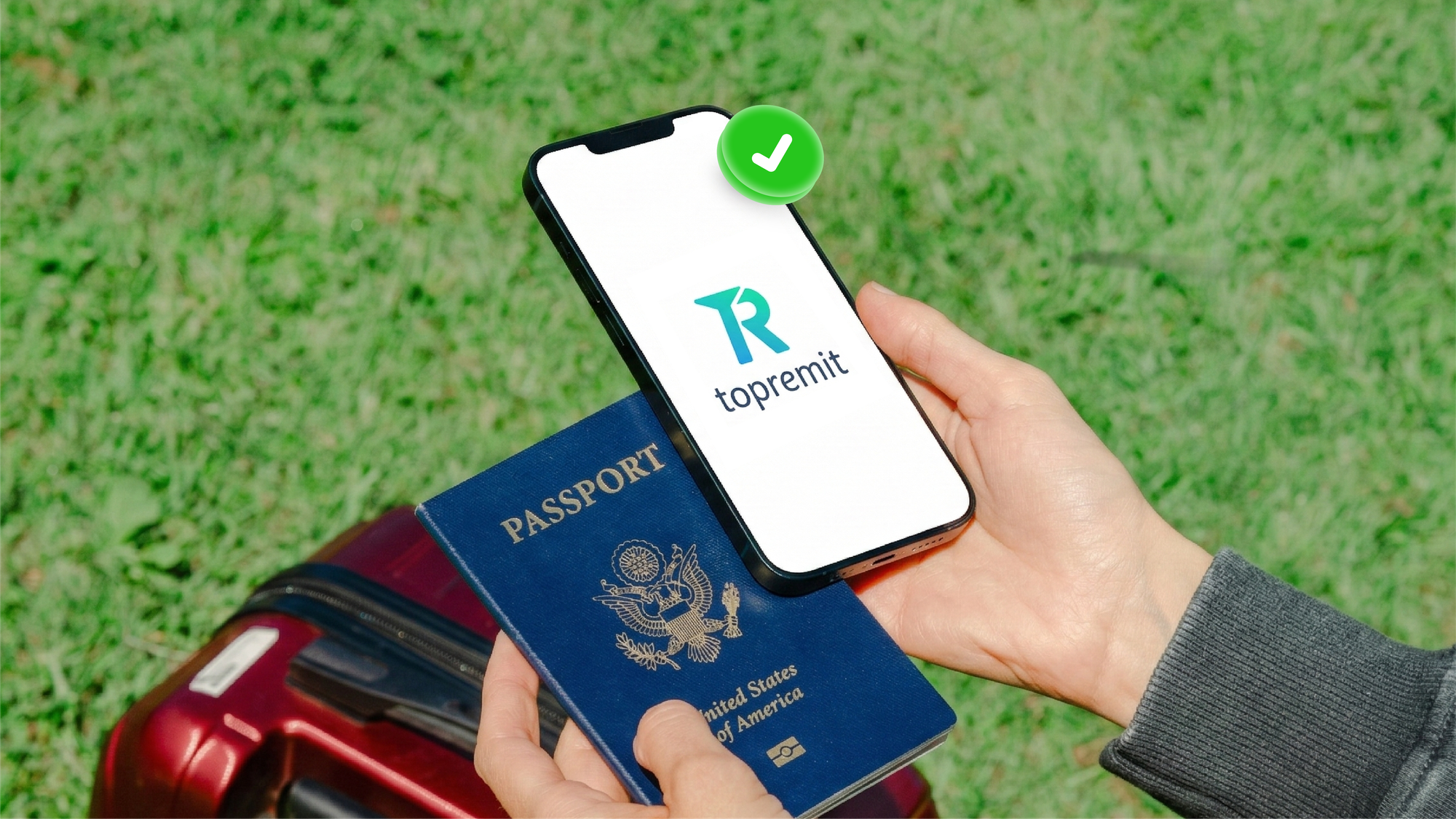 Traveler holding a passport and smartphone displaying the Topremit app during an international trip.